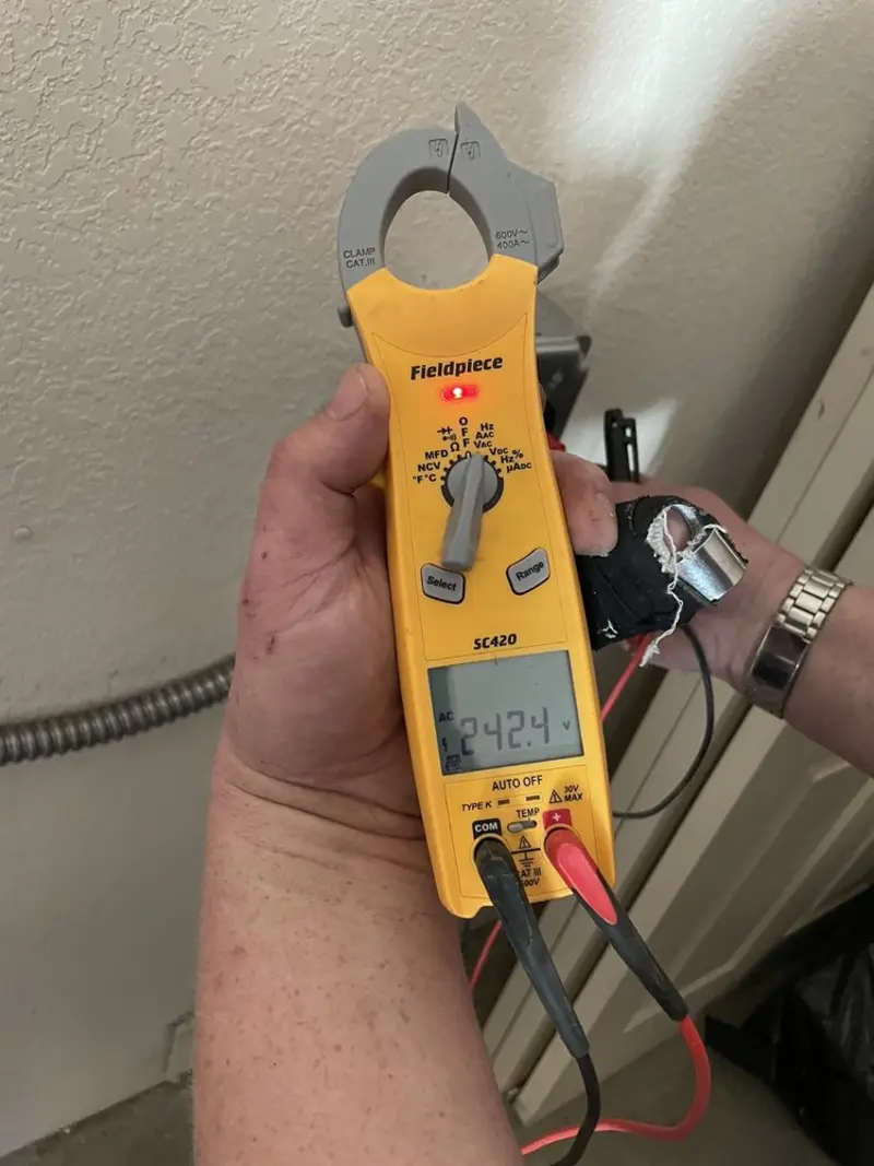 Voltage testing with clamp meter during Recessed Lighting Installation in Hailey